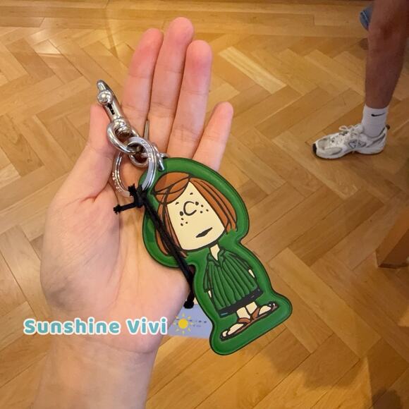 NWT Coach x Peanuts 75th Peppermint Patty Bag Charm CBG57 Kelly Green Multi - Picture 1 of 7